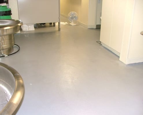 Epoxy restroom floor installation at Norpac Foods