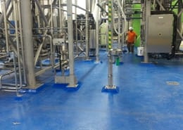 Urethane base with Blue epoxy top coat flooring installation at brewery