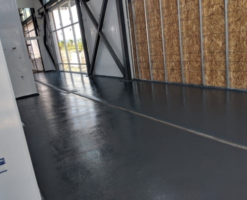 Urethane commercial floor install with epoxy topcoat at Nordic Brew Works in Montana