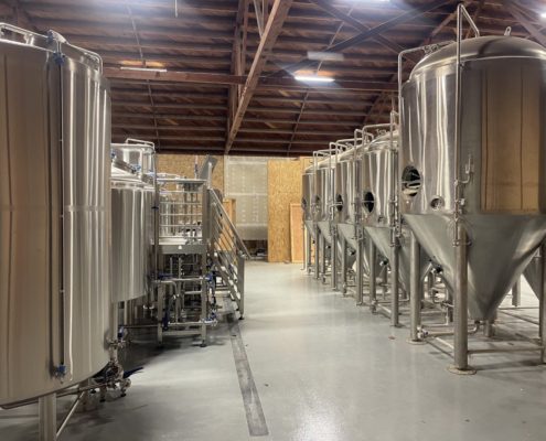 Northern California epoxy brewery flooring installation with brew tanks in Chico CA