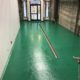 Urethane base with Epoxy top coat commercial flooring installation in Alaska