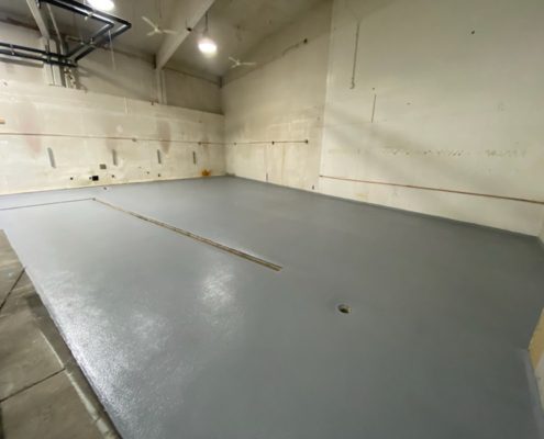 Urethane Base with Epoxy topcoat industrial flooring installation at Seattle Wa brewery