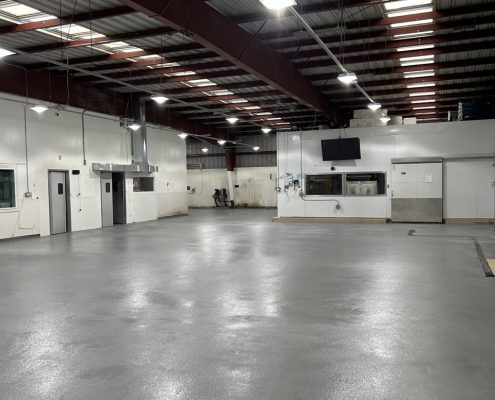 Seafood processing plant flooring installation in California using epoxy and urethane